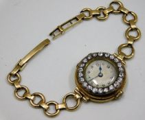 An antique 18ct gold cased 15 jewelled wrist watch