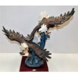 A mounted resin eagle group 20in high