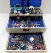 A three tier jewellery box with contents