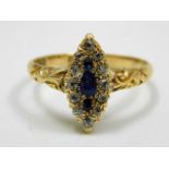 An antique 18ct gold ring set with sapphire & diamond with carved shank size N 3g