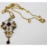 A 9ct gold chain & pendant a/f set with red paste