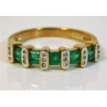 A 9ct gold half eternity ring set with diamond & e