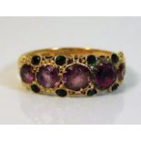 An antique Suffragette style ring set with garnet