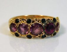 An antique Suffragette style ring set with garnet