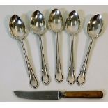 A set of five silver spoons 64.6g twinned with a a