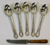 A set of five silver spoons 64.6g twinned with a a