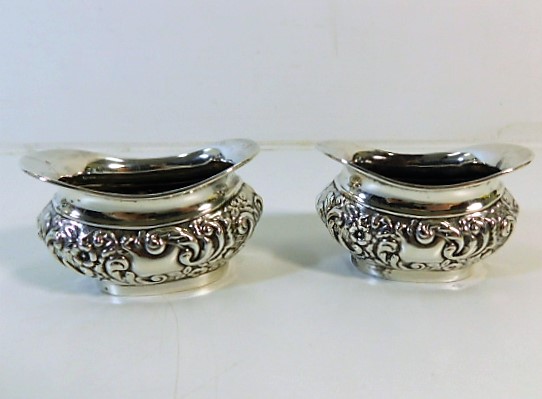 A pair of Joseph Gloster Birmingham 1908 silver sa