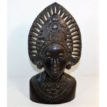 A 19thC. carved wooden deity 13.25in high