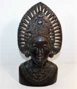 A 19thC. carved wooden deity 13.25in high
