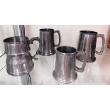 Four pewter tankards