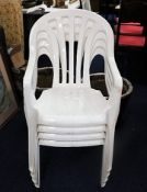 Four moulded plastic garden chairs