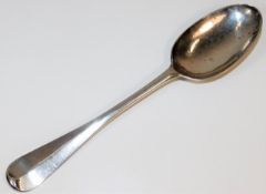 A George II silver serving spoon, naively initiall