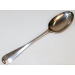 A George II silver serving spoon, naively initiall