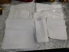 A quantity of seven linen table cloths