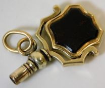 A small Victorian watch key, tests at least 9ct go