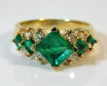 A 14ct gold ring set with emerald & diamond 6.3g s