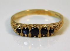 A 9ct gold sapphire ring with carved mount 2.8g si