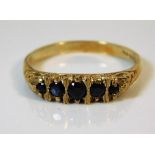 A 9ct gold sapphire ring with carved mount 2.8g si