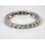 An 18ct gold eternity ring set with diamonds 3.2g