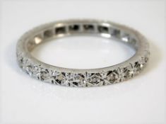An 18ct gold eternity ring set with diamonds 3.2g