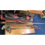 A collection of various golf clubs including hicko