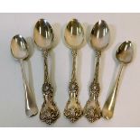 Three patterned silver spoons twinned with a pair