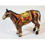 A Japanese clockwork tinplate walking horse by Mik