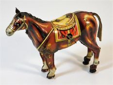 A Japanese clockwork tinplate walking horse by Mik