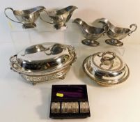 Two pairs of antique silver plated sauce boats, a