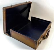 A vintage leather briefcase 15.5in wide x 11.5in d