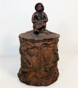 A c.1900 figurative tobacco jar, marked to base FG