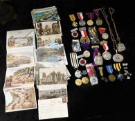 A quantity of mixed postcards & sporting medals