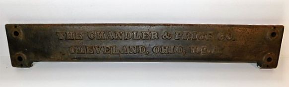 A solid brass plaque "The Chandler & Price Co. Cle