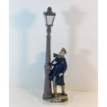 A large Lladro figure depicting lamp lighter (lack