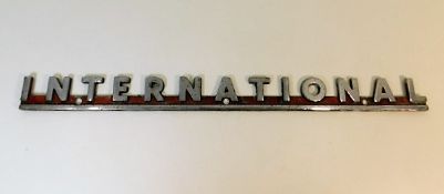 A chrome "International" Fire Engine maker plaque