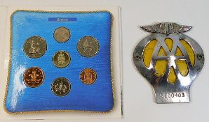 A UK coin set twinned with an AA badge