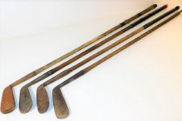 Four hickory golf clubs