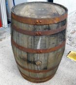 A coopered oak bourbon whisky barrel, 35in high x