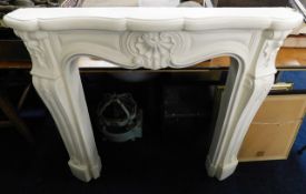 A decorative & ornate cast fire surround