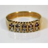A 9ct gold ring set with amethyst & simulated ston
