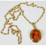 A 9ct gold chain & amber pendant 16in long 4.5g