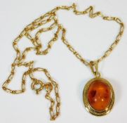 A 9ct gold chain & amber pendant 16in long 4.5g