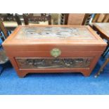 An Oriental carved camphor wood chest 36.5in wide