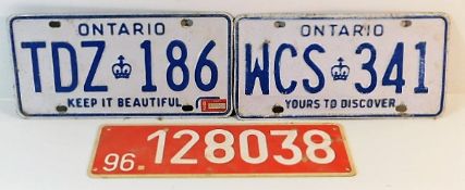 Two Canadian number plates & one other