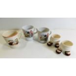 Three pieces of nursery ware twinned with a pair o