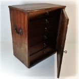 A small collectors cabinet with six drawers & lock