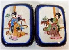 A pair of Japanese porcelain silver mounted belt b