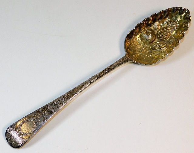 A George III silver berry spoon by William Chawner