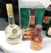 A bottle of Irish Mist liqueur, a bottle of Goldsc