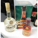 A bottle of Irish Mist liqueur, a bottle of Goldsc